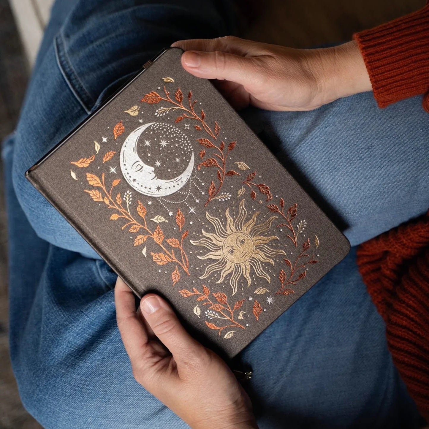 Harvest Moon Notebook held open in a cozy setting