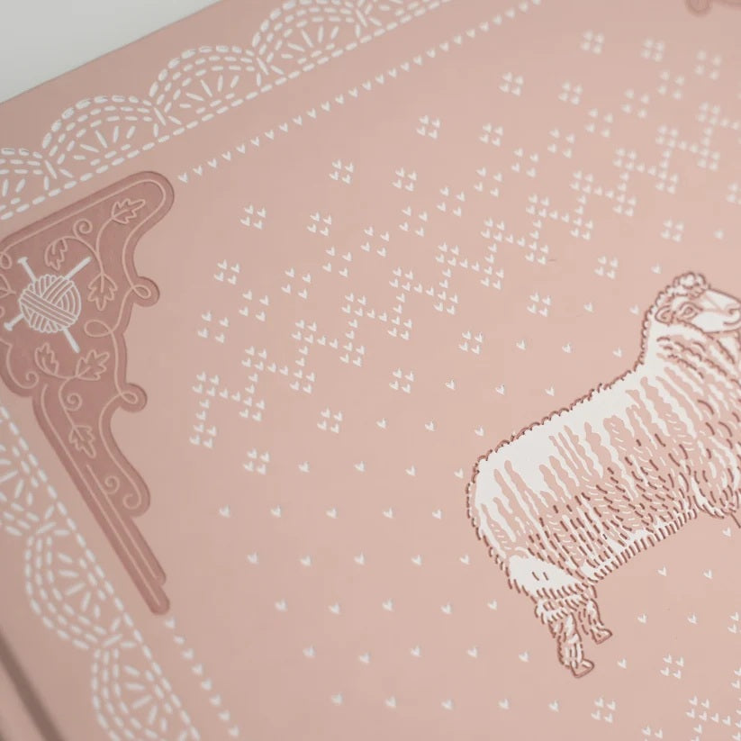 Close view of the Homespun Notebook sheep and stitch cover details
