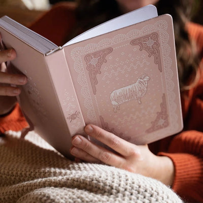 Homespun Notebook held open in a cozy setting